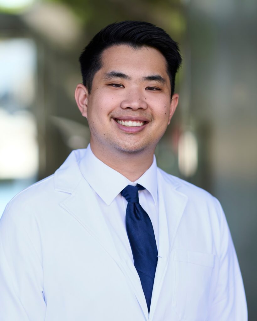 A professional headshot of Dr. Felix Hong