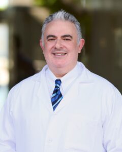 A professional headshot of Dr. Gennady Landa