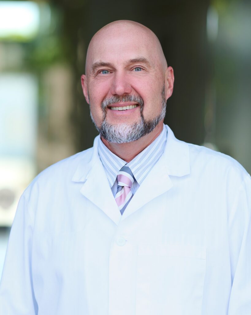 A professional headshot of Dr. Alexei Mizin